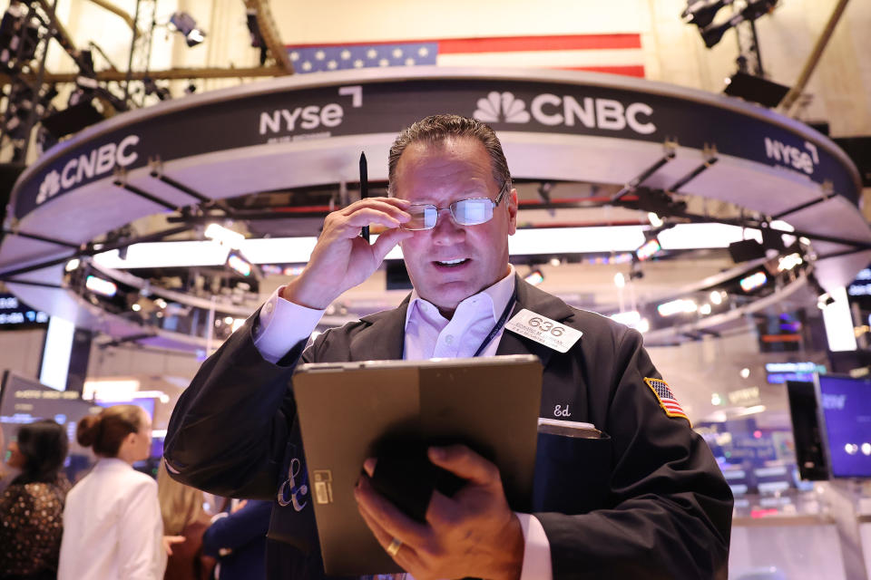 NEW YORK, NEW YORK - JULY 31: Traders work on the floor of the New York Stock Exchange during morning trading on July 31, 2024 in New York City.  Stocks opened higher amid recent earnings reports and the market is awaiting an interest rate decision from Federal Reserve Chair Jerome Powell.  (Photo by Michael M. Santiago/Getty Images)