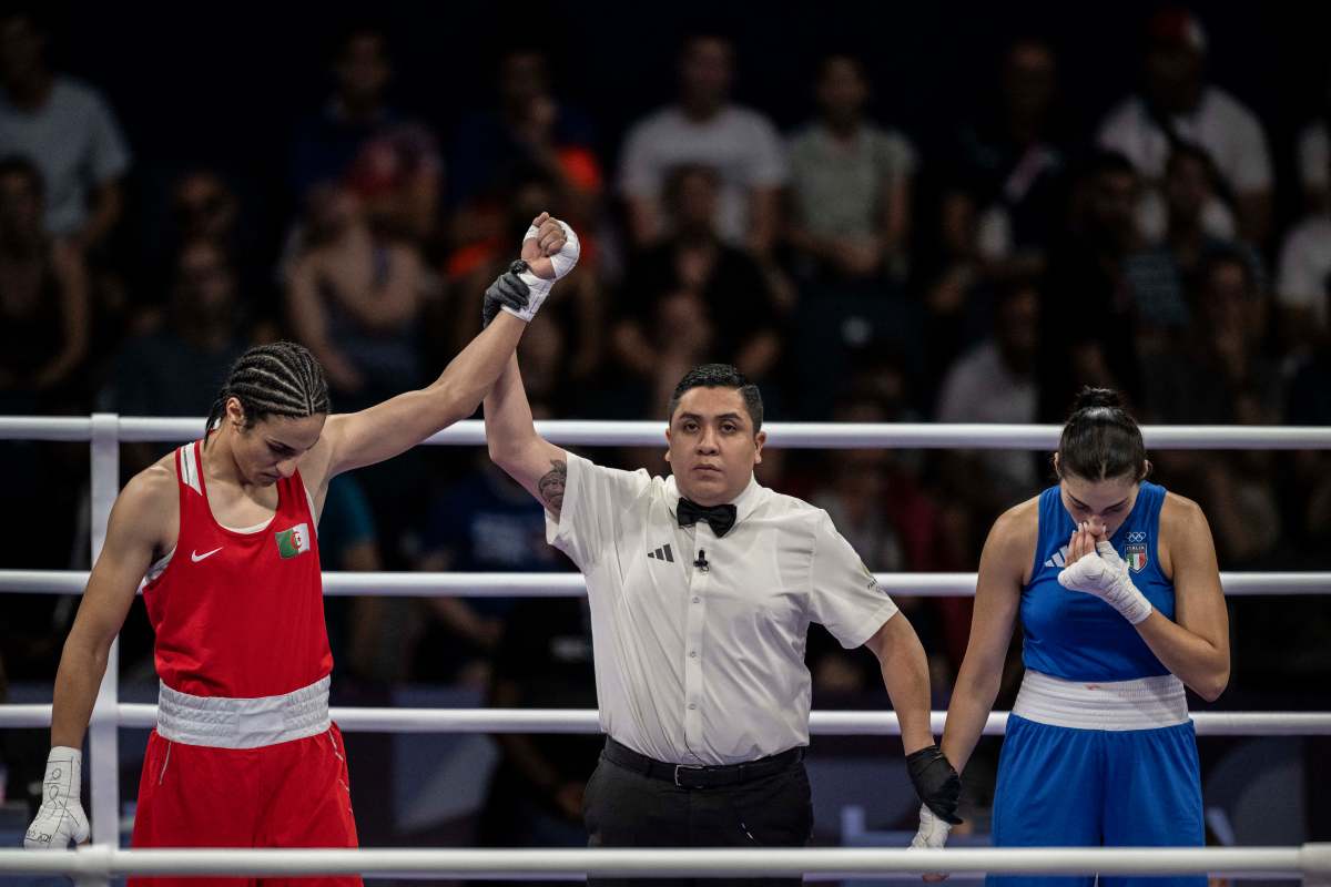 Algeria's Imane Khelif (red) and Italy's Angela Carini after their match at the 2024 Olympic Games at the North Paris Arena in Villepinte on August 1, 2024.